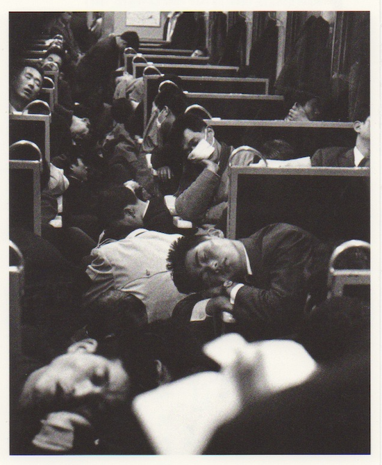 people asleep on train